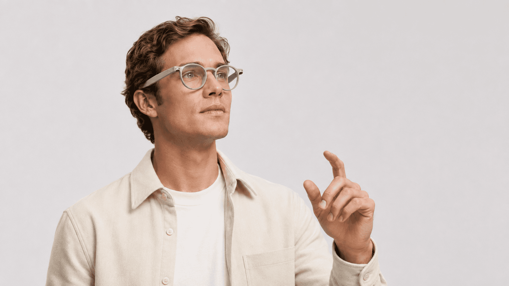 A person wearing Ororrin Glasses and reaching forward