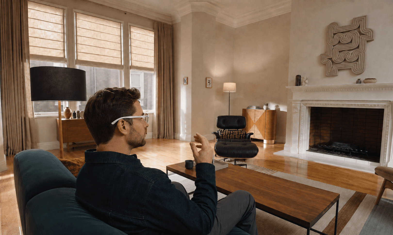 A person wearing Ororrin Glasses in a warm living room